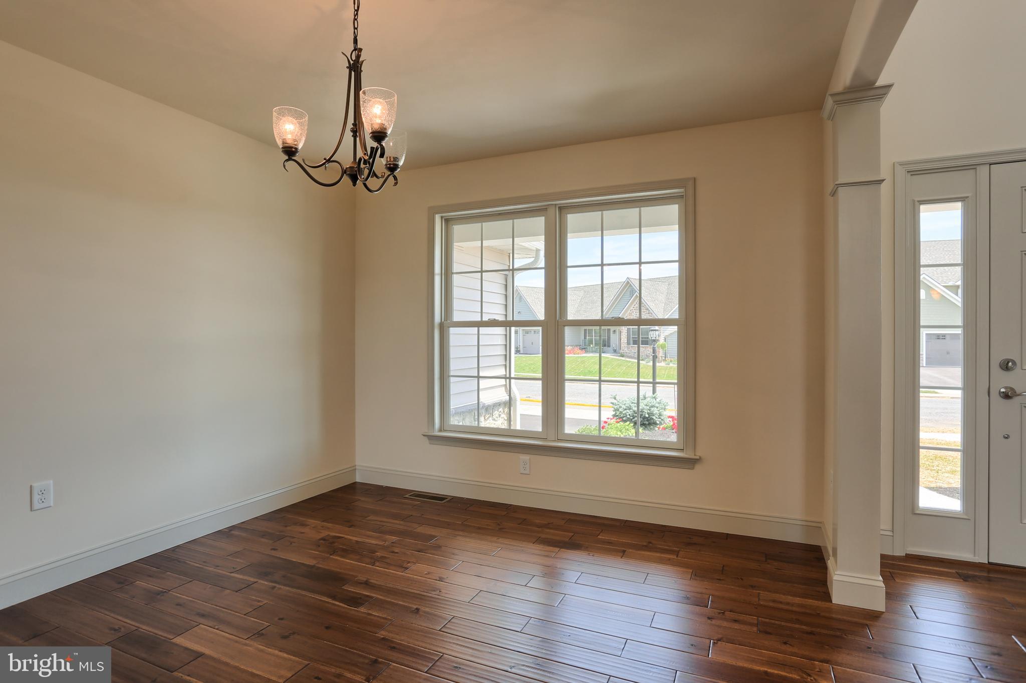 17 Rolling Meadow Road Lebanon, PA 17046 - Photo 9 of 41 a view of an empty room with wooden floor and a window