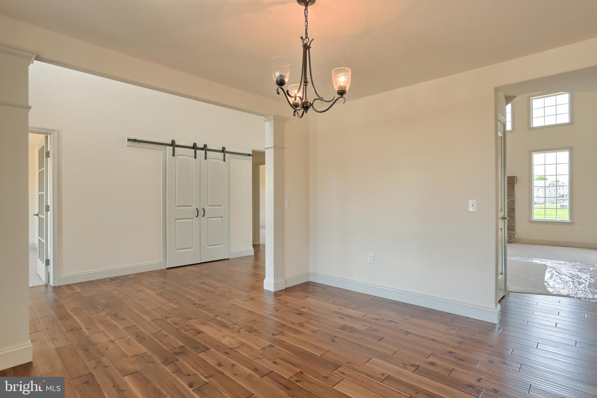 17 Rolling Meadow Road Lebanon, PA 17046 - Photo 10 of 41 a view of a livingroom with a chandelier fan and wooden floor