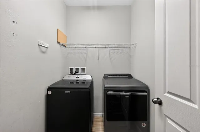 a utility room with washer and dryer