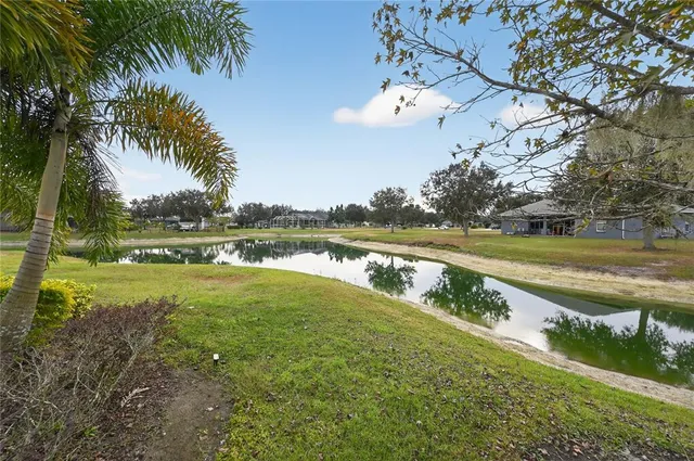 a view of a lake with a big yard