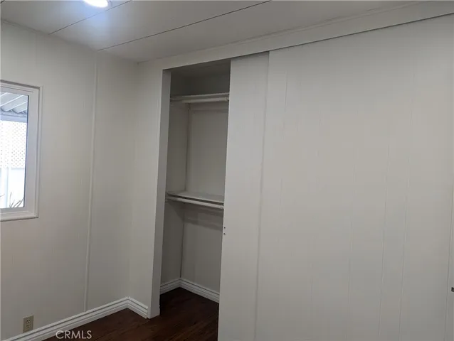 a view of walk in closet with window