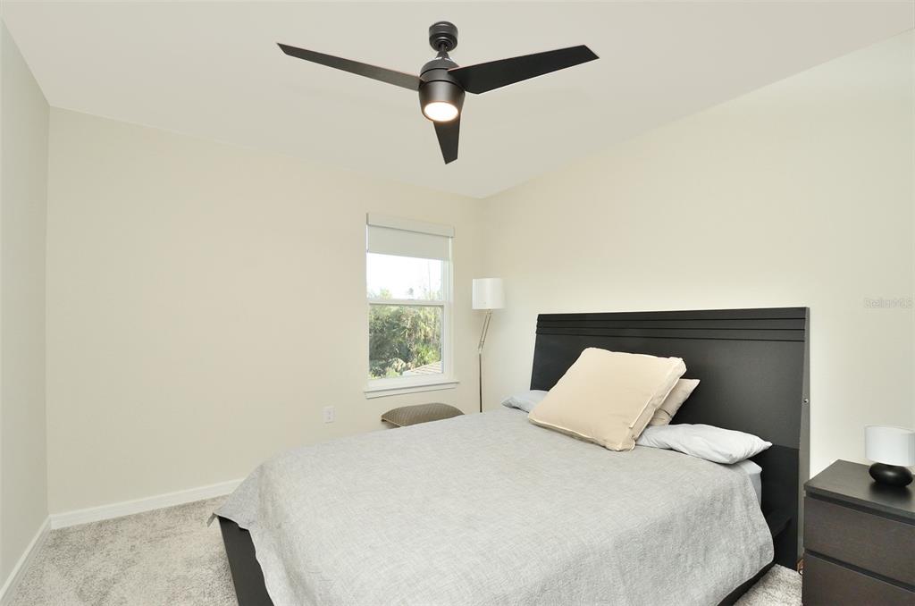 4963 Royal Point Avenue Kissimmee, FL 34746 - Photo 18 of 27 a bedroom with a bed and a window
