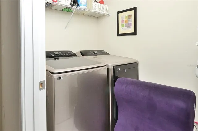a utility room with dryer and washer