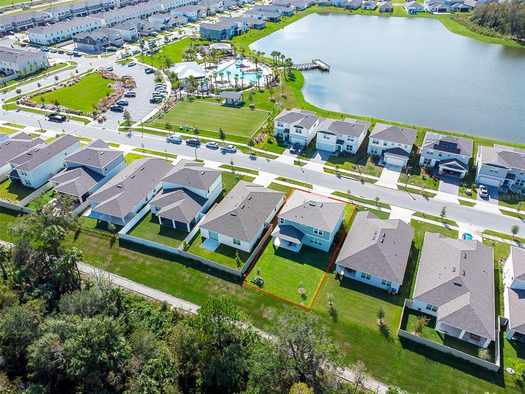 4963 Royal Point Avenue Kissimmee, FL 34746 - Photo 3 of 27 an aerial view of residential houses with outdoor space and swimming pool