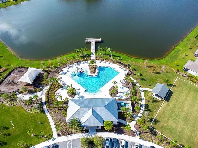 an aerial view of house with yard swimming pool and outdoor seating