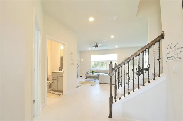 a view of entryway and hall with a living room