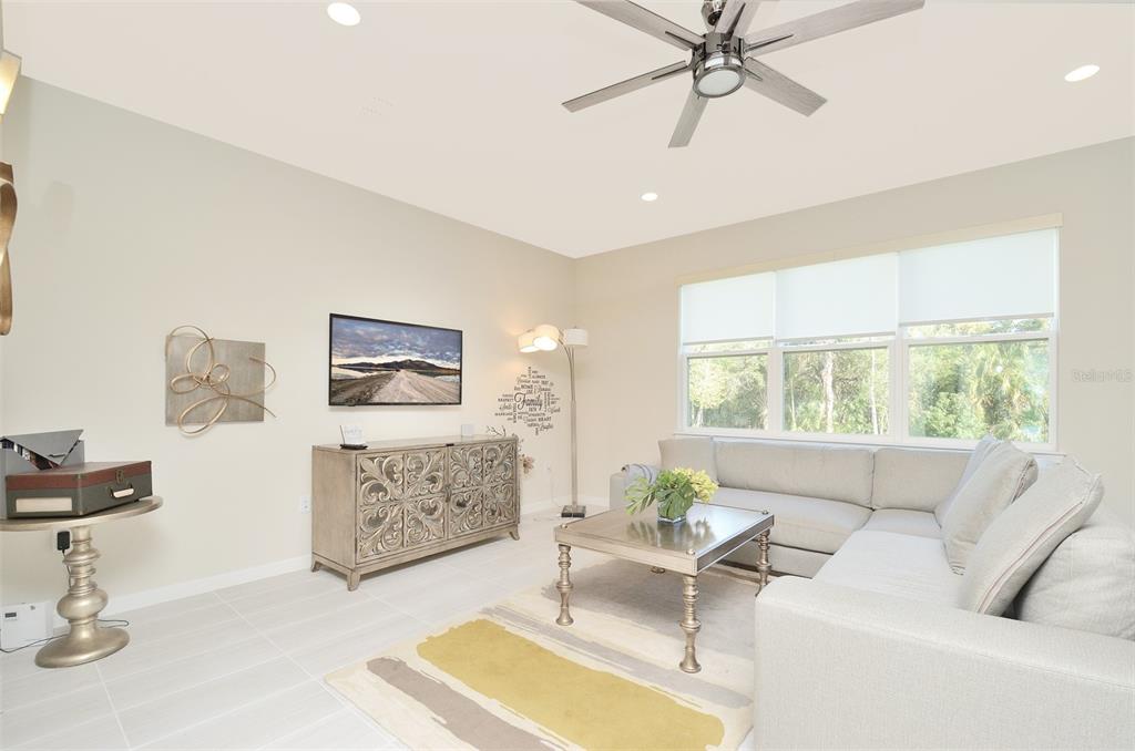 4963 Royal Point Avenue Kissimmee, FL 34746 - Photo 6 of 27 a living room with furniture and a large window