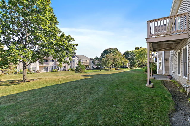 1871 Fox Run Drive, Unit A Elk Grove Village, IL 60007 - Photo 26 of 27 a view of a fountain in front of a house