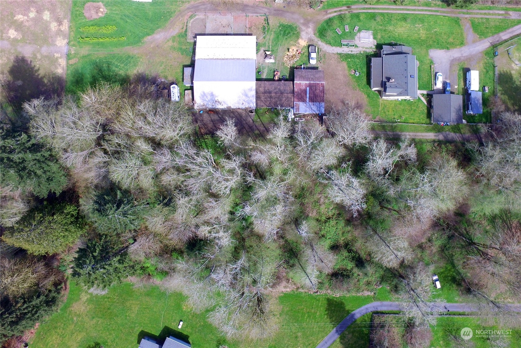 1 Bethel Burley Road Southeast Port Orchard, WA 98367 - Photo 12 of 26 an aerial view of a house with a yard and outdoor seating