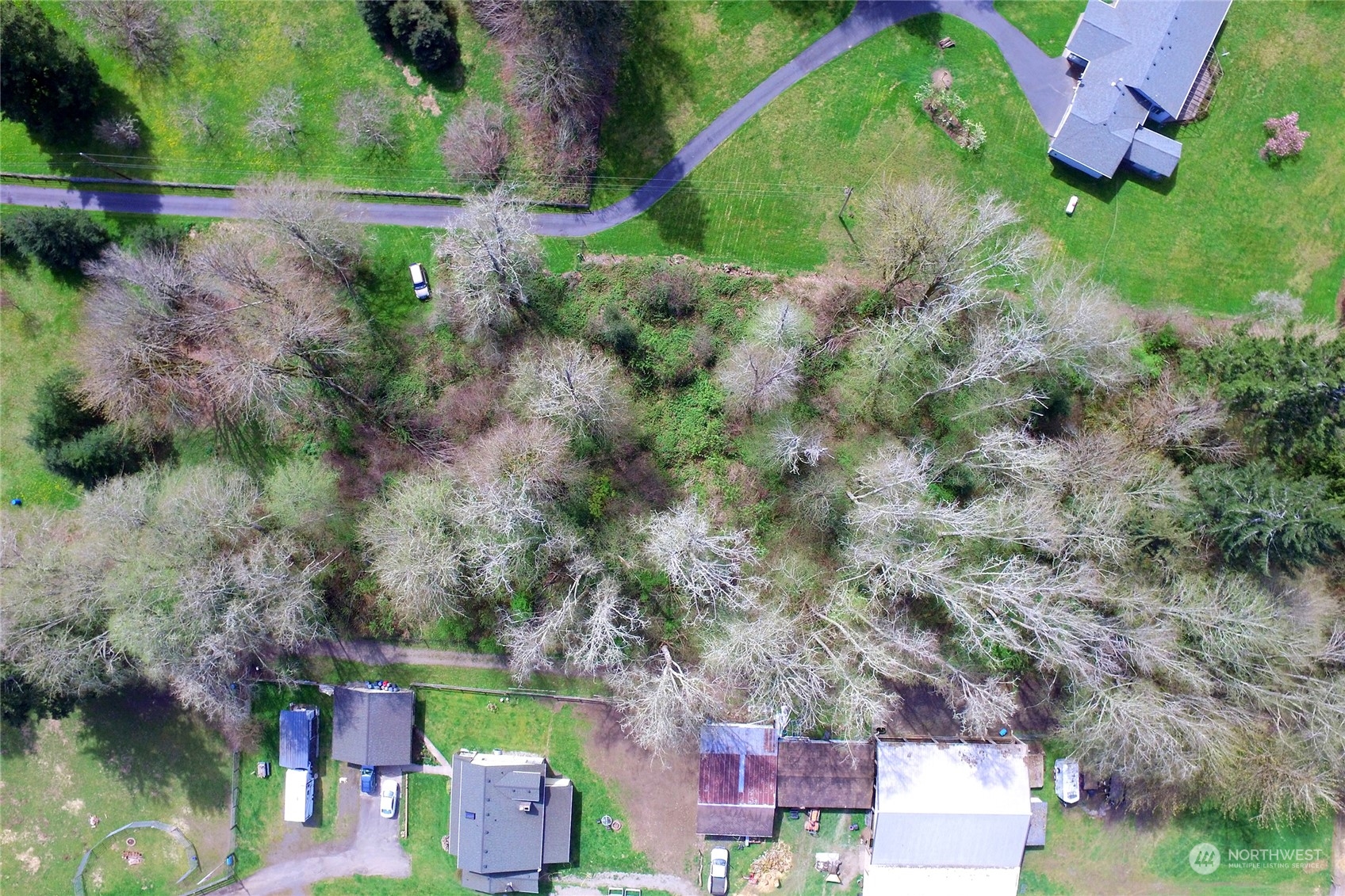 1 Bethel Burley Road Southeast Port Orchard, WA 98367 - Photo 16 of 26 an aerial view of a house with a yard
