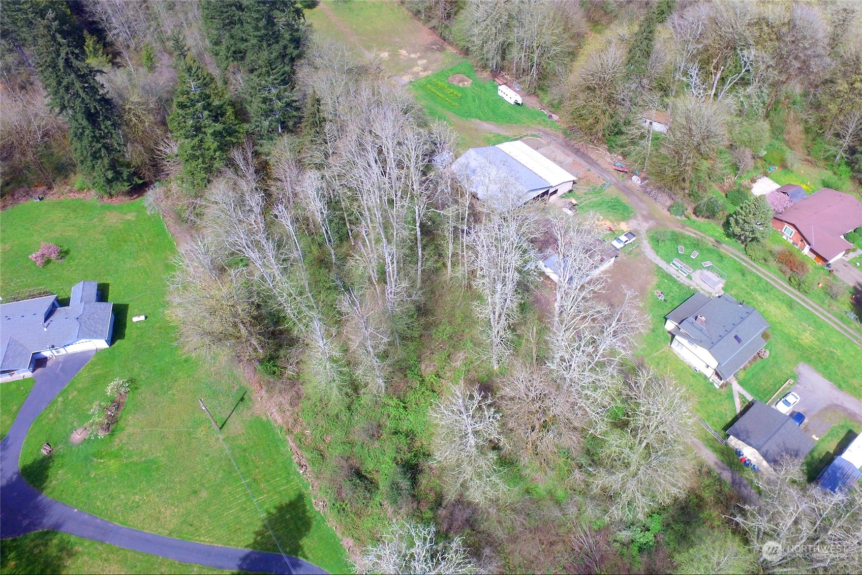 1 Bethel Burley Road Southeast Port Orchard, WA 98367 - Photo 18 of 26 an aerial view of residential houses with outdoor space