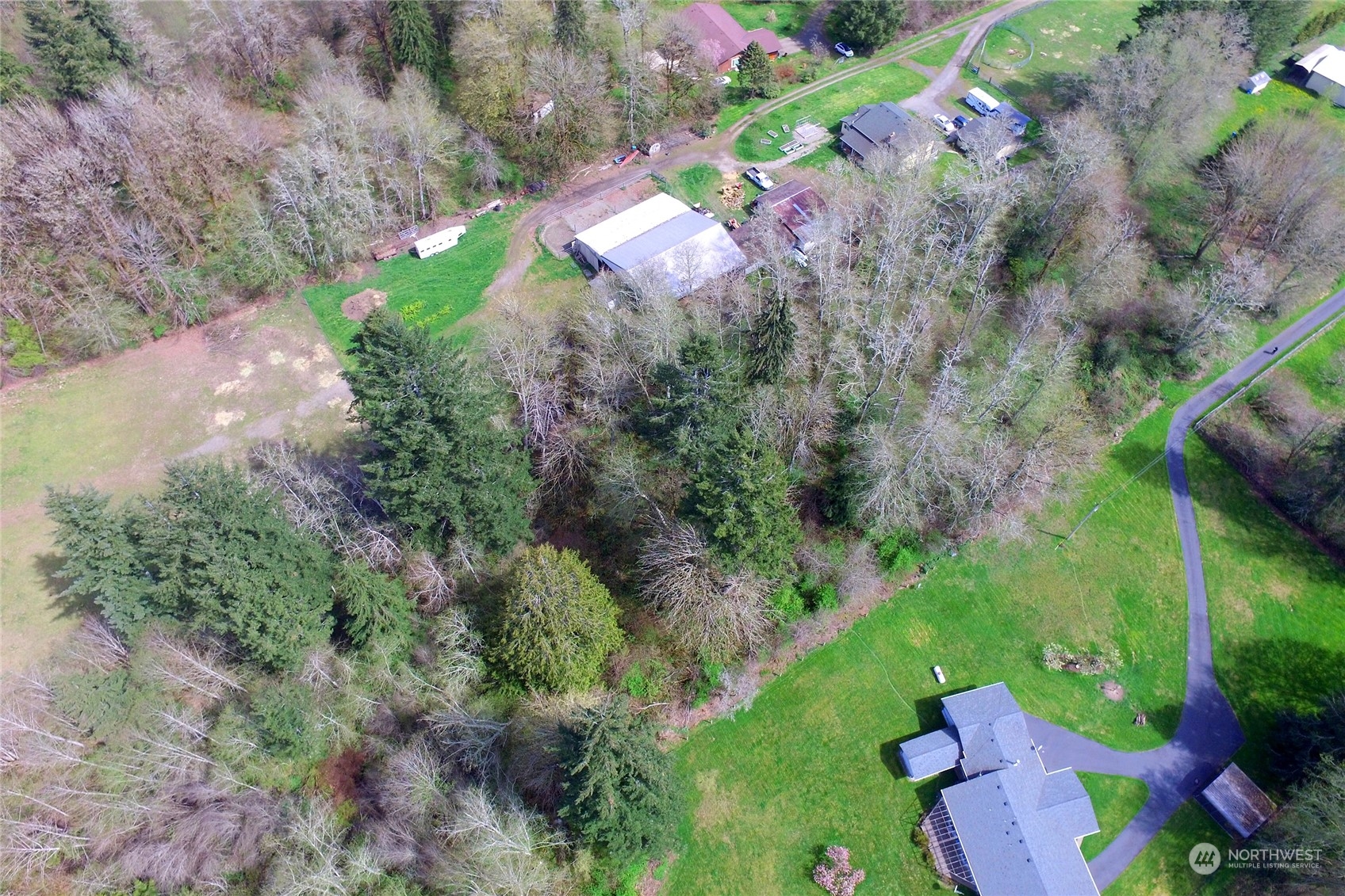1 Bethel Burley Road Southeast Port Orchard, WA 98367 - Photo 10 of 26 an aerial view of a house with a yard and lake view