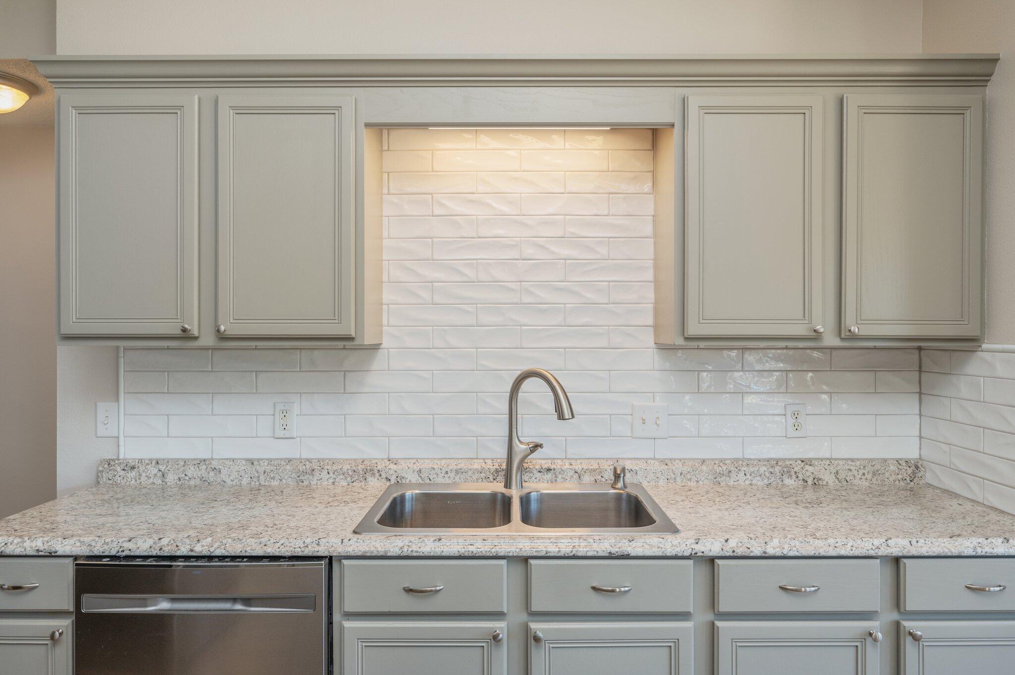 459 Jillian Drive Crestview, FL 32536 - Photo 14 of 46 a kitchen with a sink and cabinets