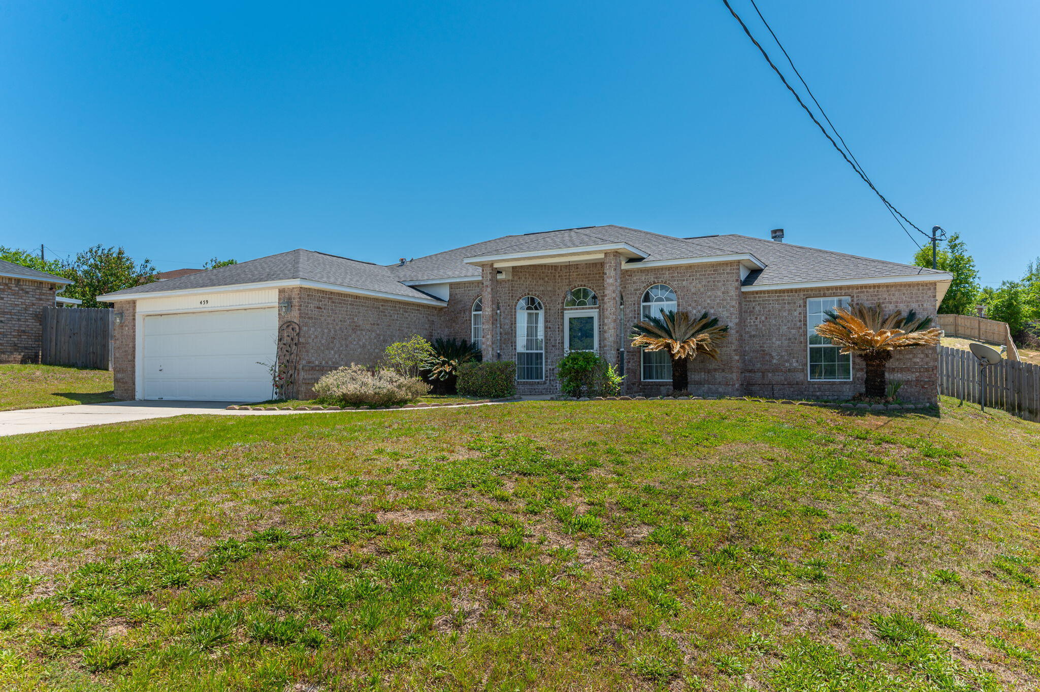 459 Jillian Drive Crestview, FL 32536 - Photo 3 of 46 a front view of a house with garden