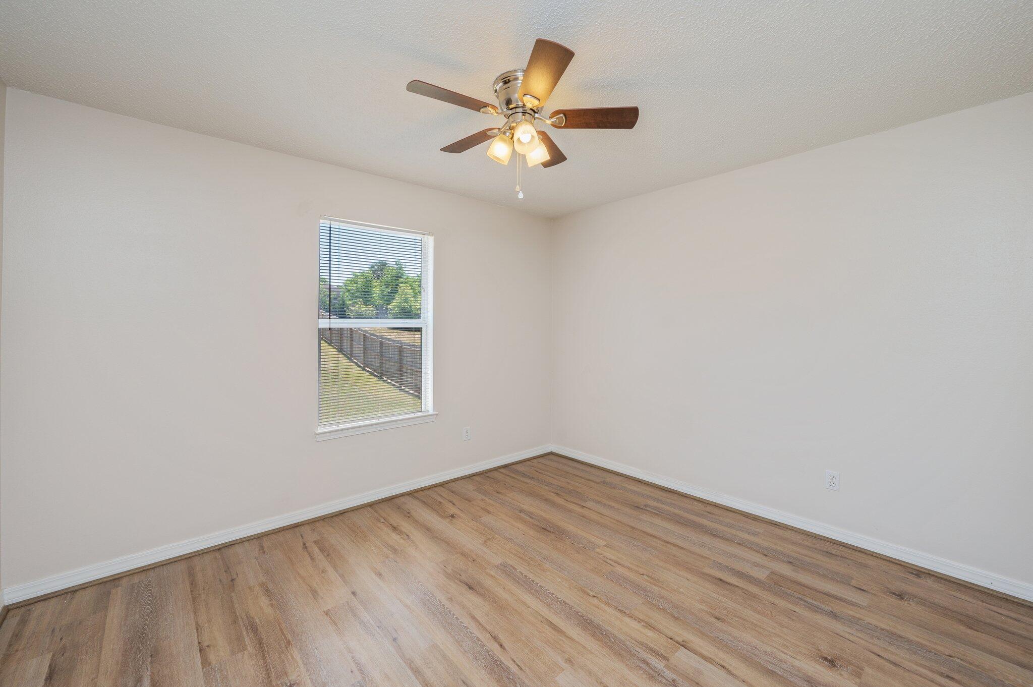 459 Jillian Drive Crestview, FL 32536 - Photo 31 of 46 wooden floor in an empty room with a window