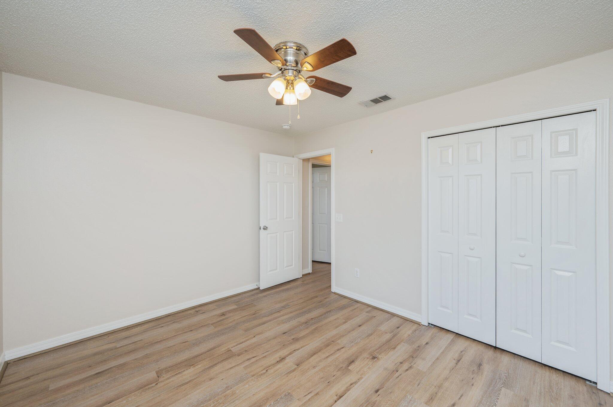459 Jillian Drive Crestview, FL 32536 - Photo 34 of 46 a view of an empty room with wooden floor