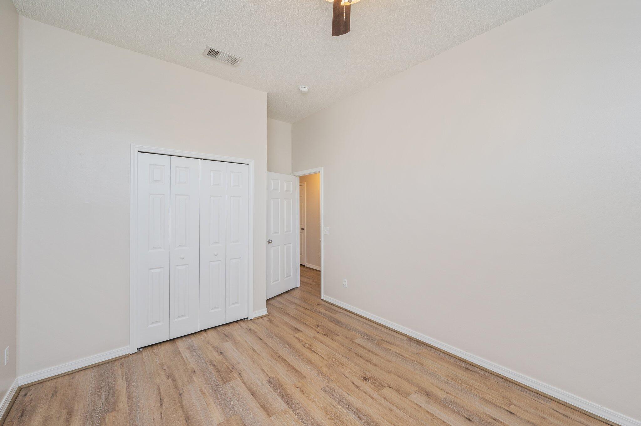 459 Jillian Drive Crestview, FL 32536 - Photo 36 of 46 a view of an empty room with wooden floor