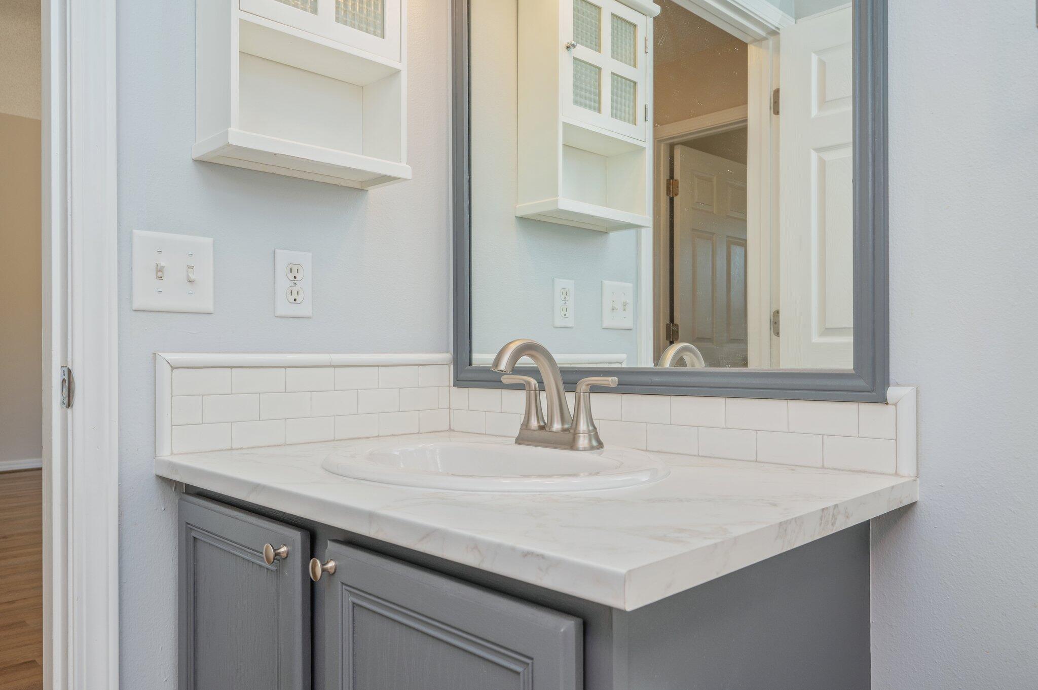 459 Jillian Drive Crestview, FL 32536 - Photo 39 of 46 a bathroom with a sink and a mirror