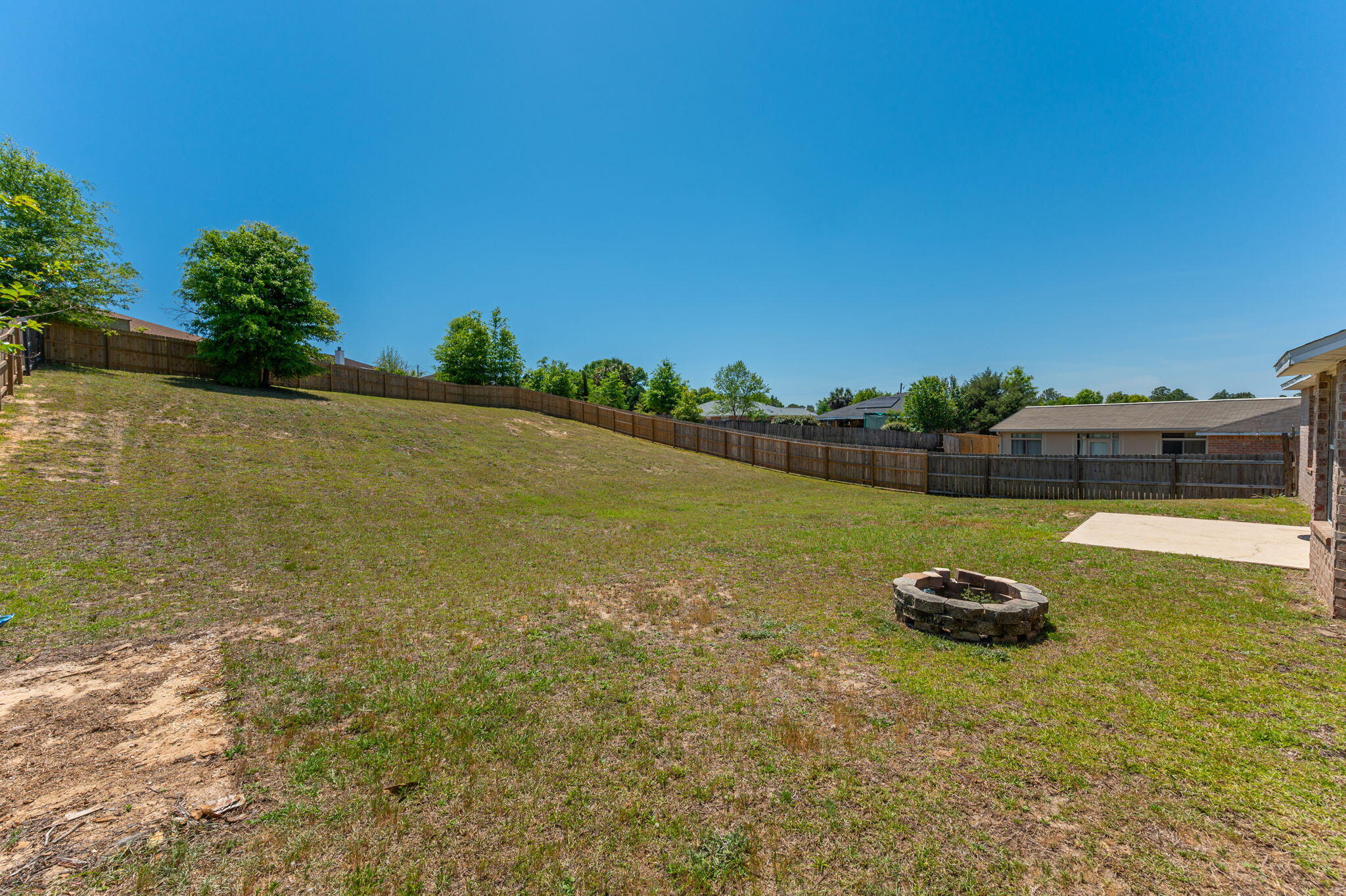 459 Jillian Drive Crestview, FL 32536 - Photo 46 of 46 a backyard of a house with lots of green space