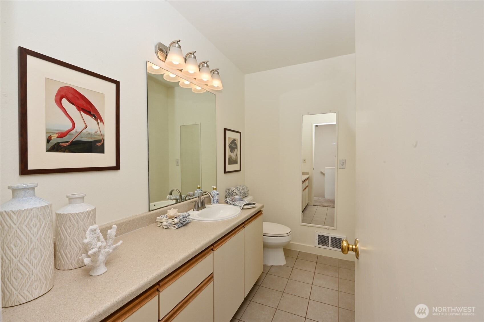 2827 Franklin Avenue East, Unit N9 Seattle, WA 98102 - Photo 13 of 23 a bathroom with a double vanity sink mirror and toilet