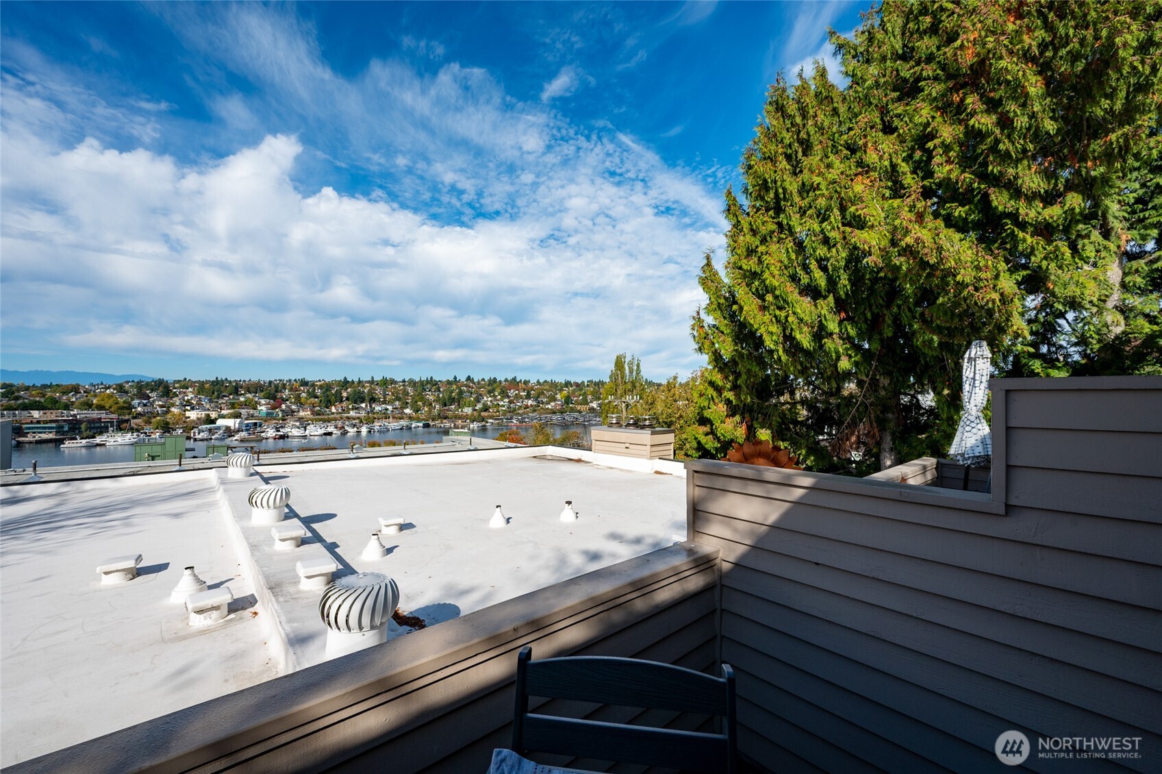 2827 Franklin Avenue East, Unit N9 Seattle, WA 98102 - Photo 19 of 23 a view of a terrace with wooden floor and city view
