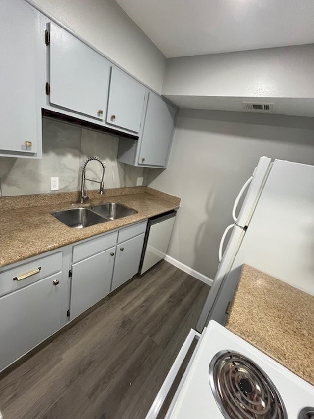5001 Lamonte Lane, Unit 116 Houston, TX 77092 - Photo 11 of 25 a kitchen with a sink and cabinets
