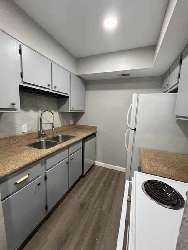 5001 Lamonte Lane, Unit 116 Houston, TX 77092 - Photo 12 of 25 a kitchen with granite countertop a sink stainless steel appliances and cabinets