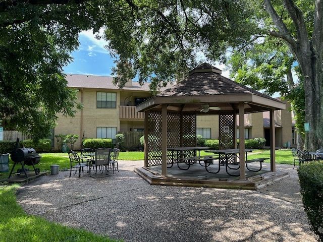 5001 Lamonte Lane, Unit 116 Houston, TX 77092 - Photo 24 of 25 a view of a house with backyard sitting area and garden