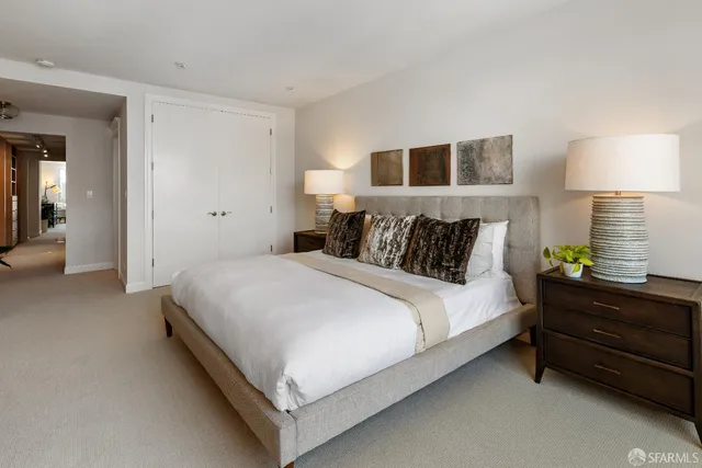 a bed room with a bed and a lamp