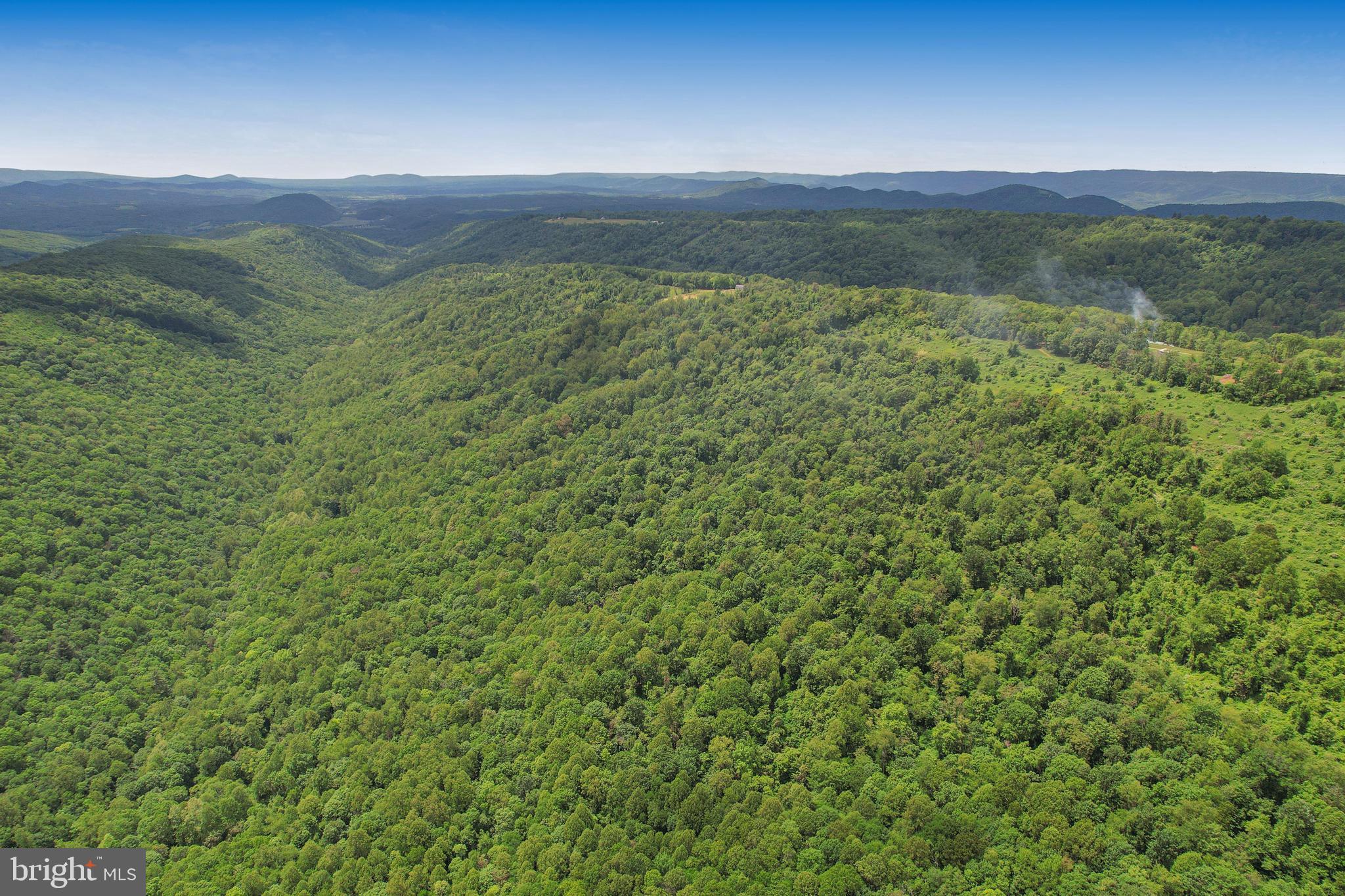 14600 Williams Road Southeast Cumberland, MD 21502 - Photo 31 of 108 a view of a lush green hillside and a houses