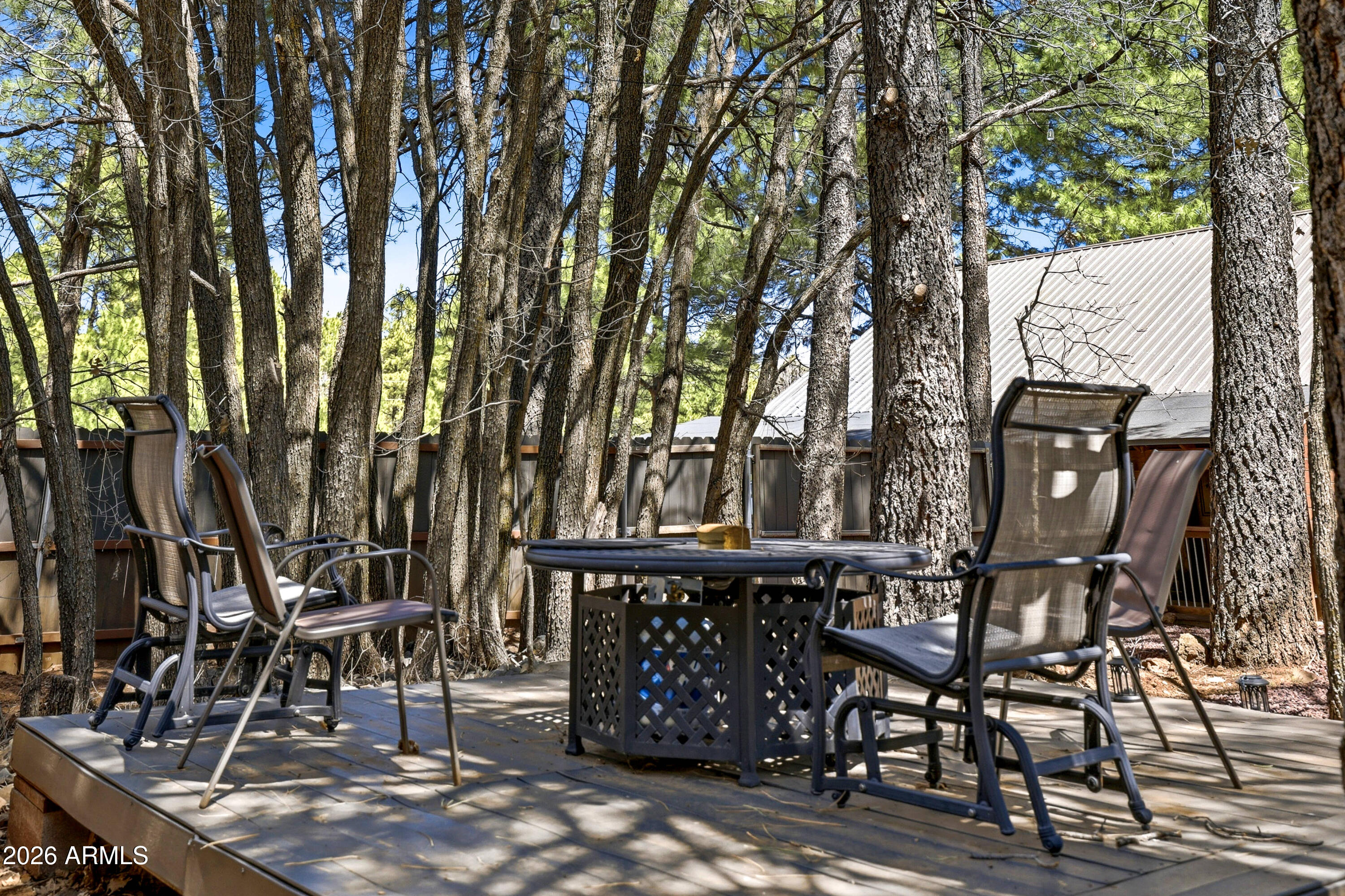 4971 Buck Springs Road Pinetop, AZ 85935 - Photo 24 of 32 a view of a chairs and table in the patio