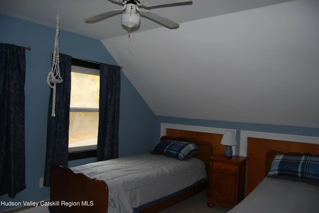 a bedroom with a bed and a table in it