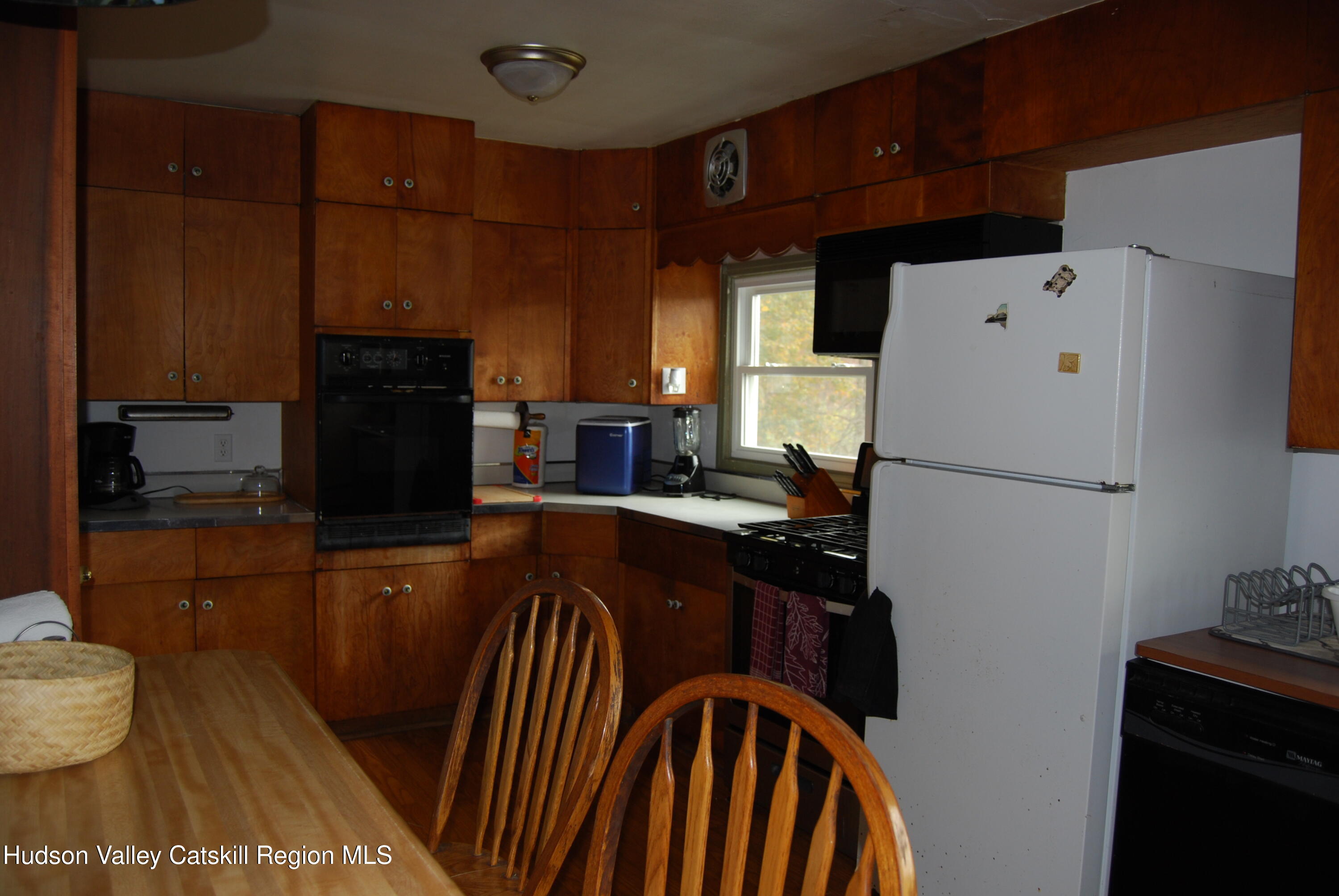 7 Harmon Heights Road Chatham, NY 12037 - Photo 2 of 25 a kitchen with stainless steel appliances granite countertop a refrigerator a stove a sink and dishwasher