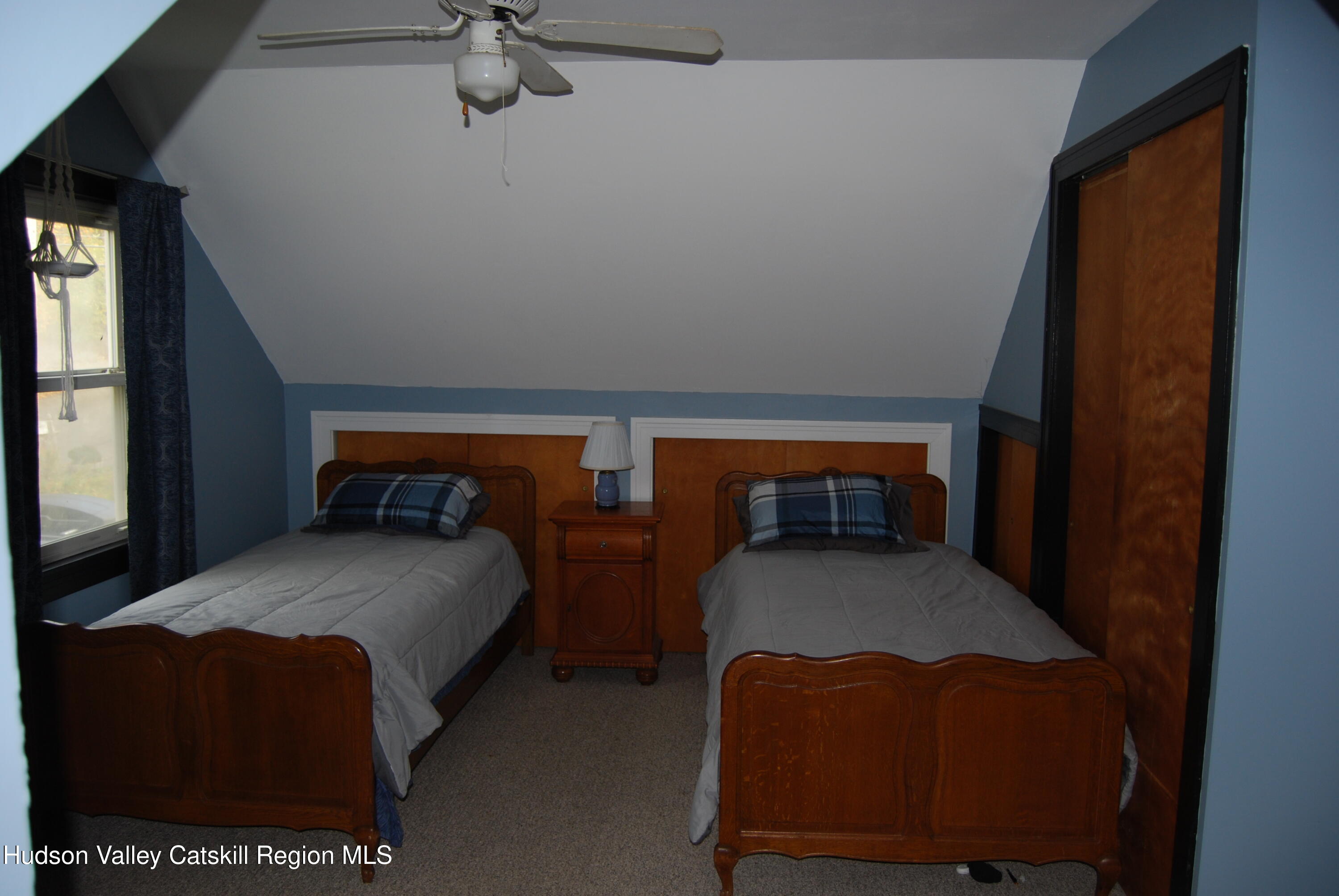 7 Harmon Heights Road Chatham, NY 12037 - Photo 21 of 25 a bedroom with a bed and a table in it