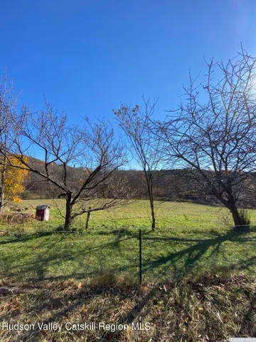 a large body of water with a building in the background