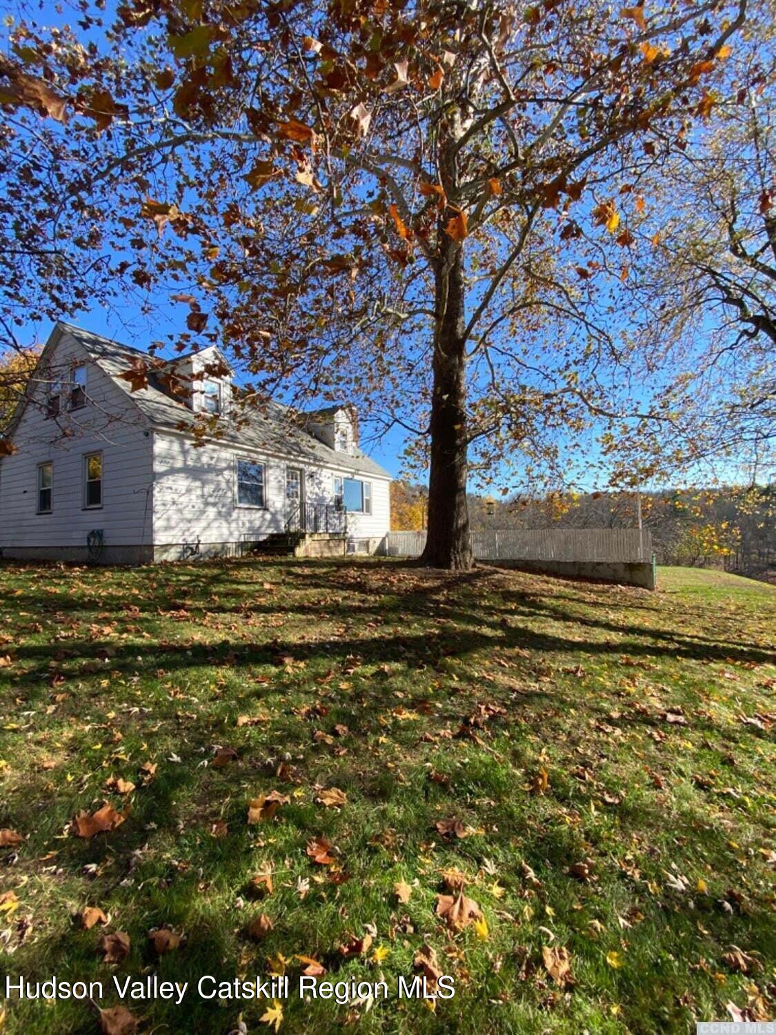7 Harmon Heights Road Chatham, NY 12037 - Photo 25 of 25 a large body of water with a building in the background