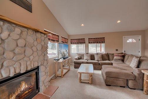 455 Apache Trail Jefferson, CO 80456 - Photo 12 of 34 a living room with furniture and a fireplace