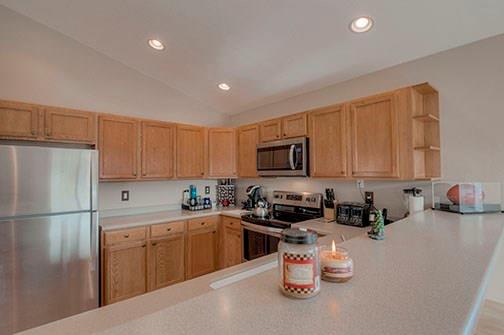 455 Apache Trail Jefferson, CO 80456 - Photo 13 of 34 a kitchen with a sink a stove and cabinets