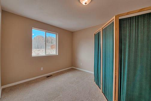 455 Apache Trail Jefferson, CO 80456 - Photo 15 of 34 an empty room with windows