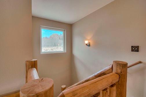 455 Apache Trail Jefferson, CO 80456 - Photo 17 of 34 a view of a room with wooden floor and a chair