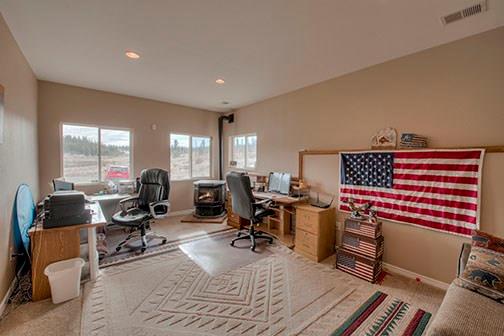 455 Apache Trail Jefferson, CO 80456 - Photo 22 of 34 a view of a livingroom with workspace and a couch