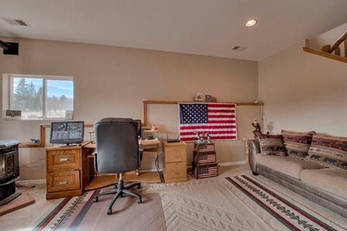 455 Apache Trail Jefferson, CO 80456 - Photo 23 of 34 a view of a workspace with furniture and a window