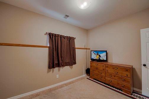 455 Apache Trail Jefferson, CO 80456 - Photo 24 of 34 a view of a room with wooden floor and cabinet