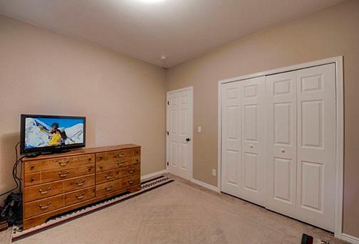 455 Apache Trail Jefferson, CO 80456 - Photo 25 of 34 a living room with furniture and flat screen tv
