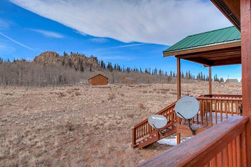 455 Apache Trail Jefferson, CO 80456 - Photo 31 of 34 a view of a backyard with furniture and a backyard