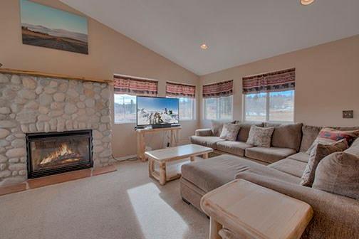 455 Apache Trail Jefferson, CO 80456 - Photo 5 of 34 a living room with furniture and a fireplace