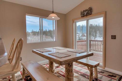 455 Apache Trail Jefferson, CO 80456 - Photo 7 of 34 a view of a dining room with furniture window and outside view