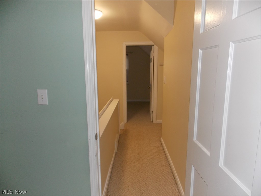 6299 South Canterbury Road Parma, OH 44129 - Photo 19 of 26 Freshly painted hallway leads to third bedroom.