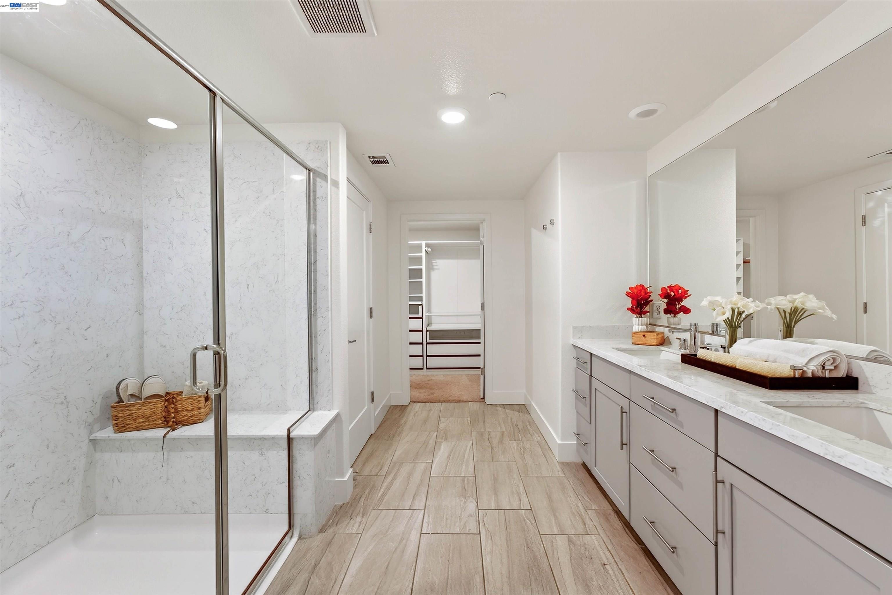 430 Montague Expressway, Unit 20 Milpitas, CA 95035 - Photo 11 of 50 a spacious bathroom with a double vanity sink and a mirror