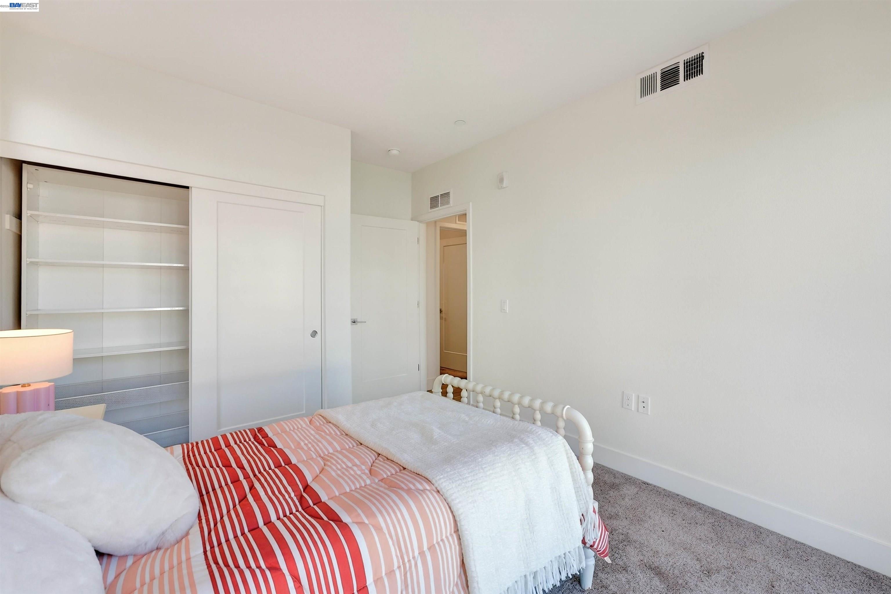430 Montague Expressway, Unit 20 Milpitas, CA 95035 - Photo 13 of 50 a bedroom with a bed and a toilet